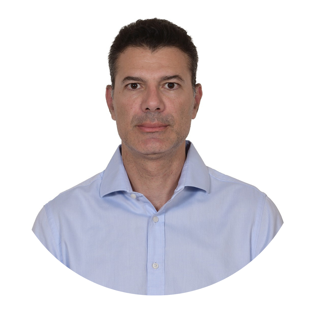 Portrait of a middle-aged man with short dark hair wearing a light blue button-down shirt, facing the camera against a white background.